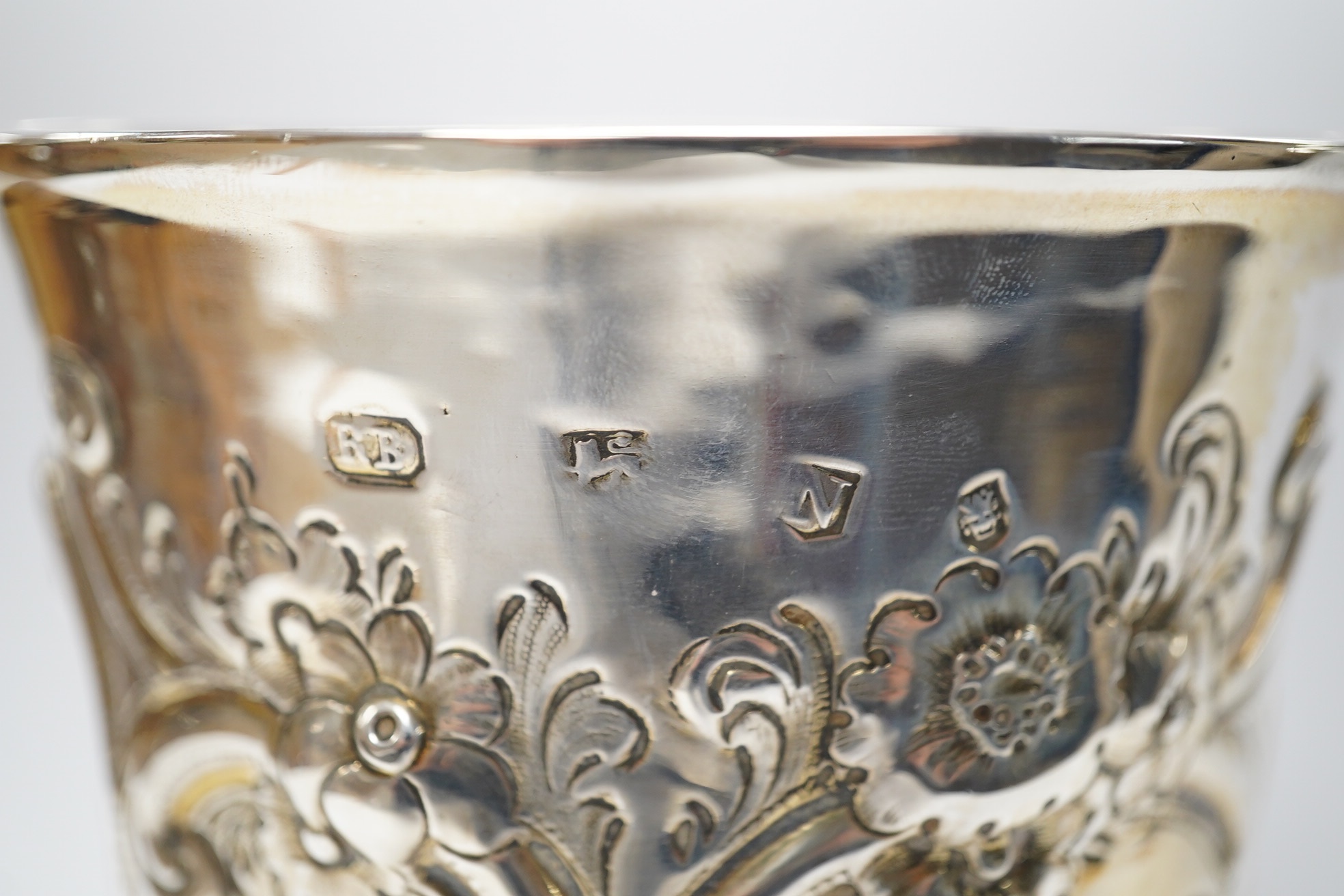 A George II silver goblet, with later embossed decoration and inscription, maker RB London, 1728, 16.6cm, 8.9oz. Condition - fair